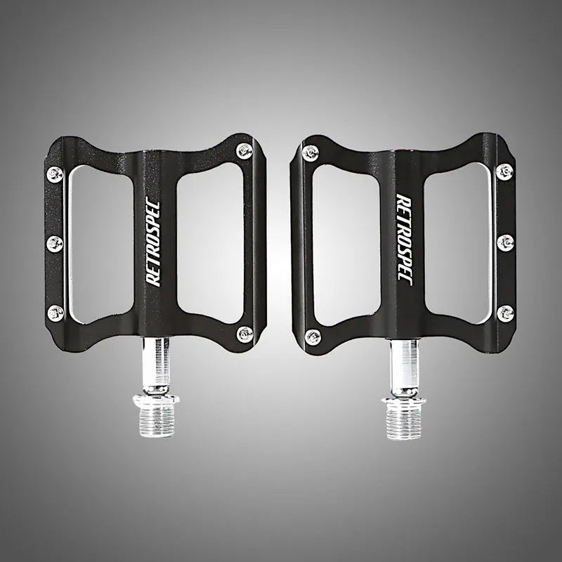 Black CNC aluminium mountain bike pedal with anti-skid nails and sealed bearing, 80x80x18mm