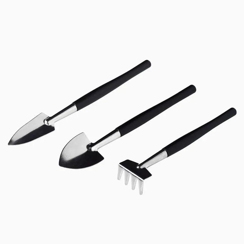 Black plastic and metal 15-piece mini succulent garden tool set displayed with shovel, tweezers, scissors, watering bottle, and cushion.