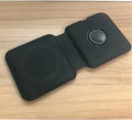 White foldable magnetic wireless charging dock showing two phones charging simultaneously at an angle.