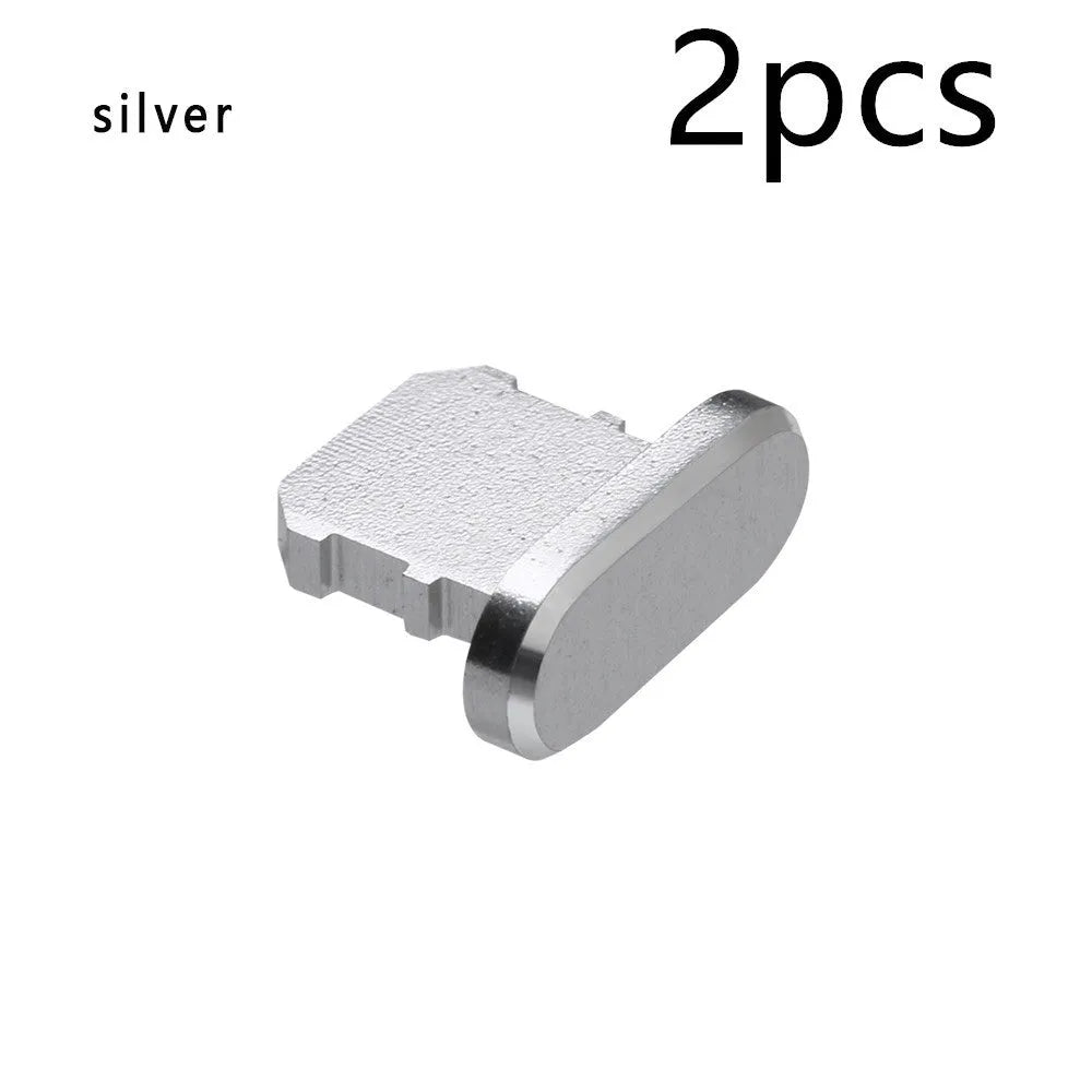 Aluminium alloy iPhone charging port dust plug in silver, shown next to an iPhone.