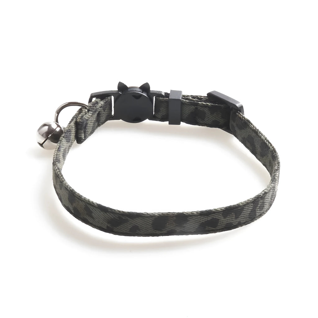 Brown cloth cat collar with attached bell on a white background