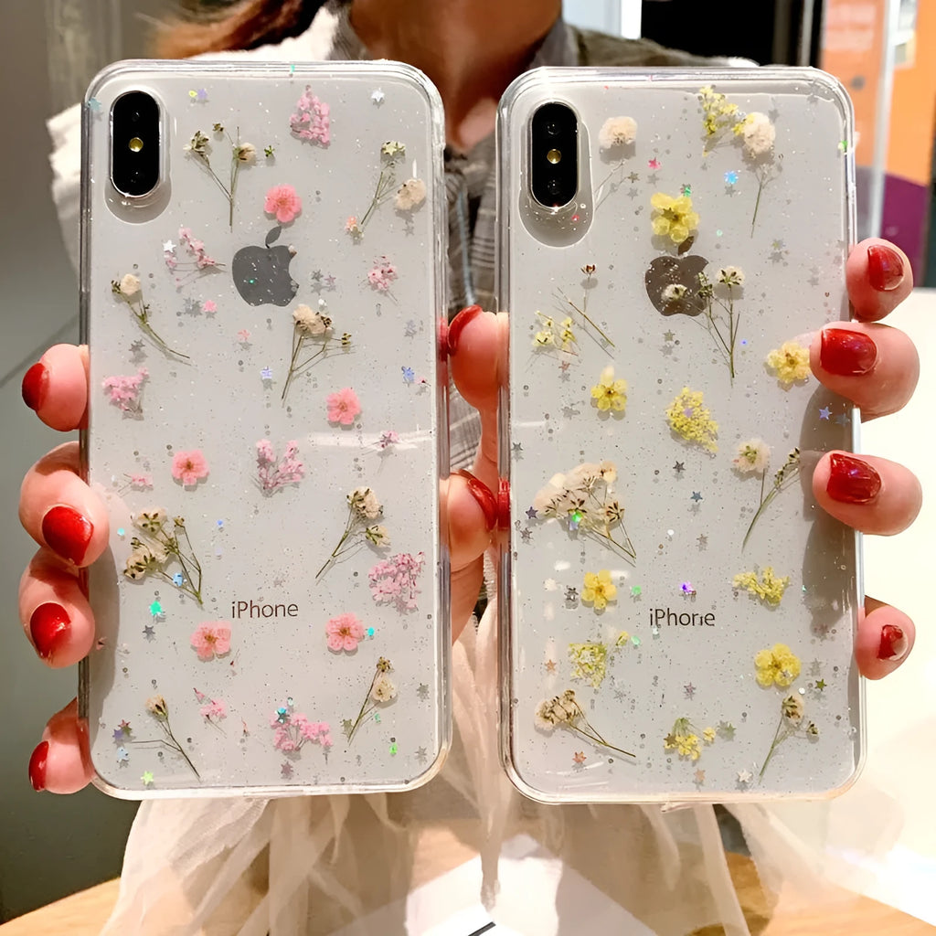 Epoxy phone case with real dried flowers and glitter on a TPU back cover, showing a blue floral pattern against a clear resin layer