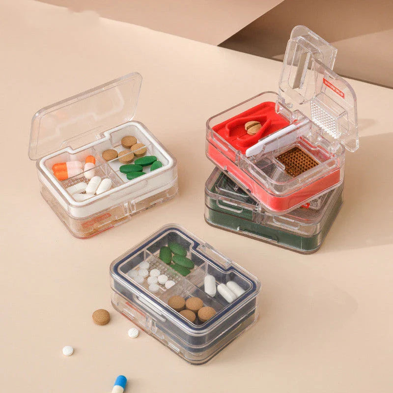 Portable mini medicine storage box with tablet cutter in red, green, blue, and white