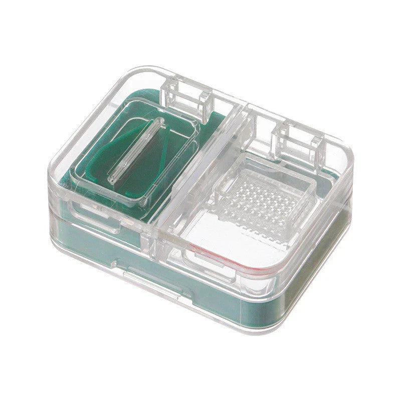Portable mini medicine storage box with tablet cutter in red, green, blue, and white