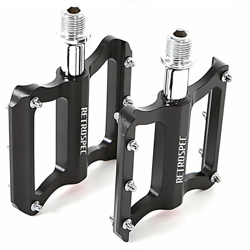 Black CNC aluminium mountain bike pedal with anti-skid nails and sealed bearing, 80x80x18mm