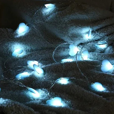 Pink battery-operated LED fairy string lights draped decoratively