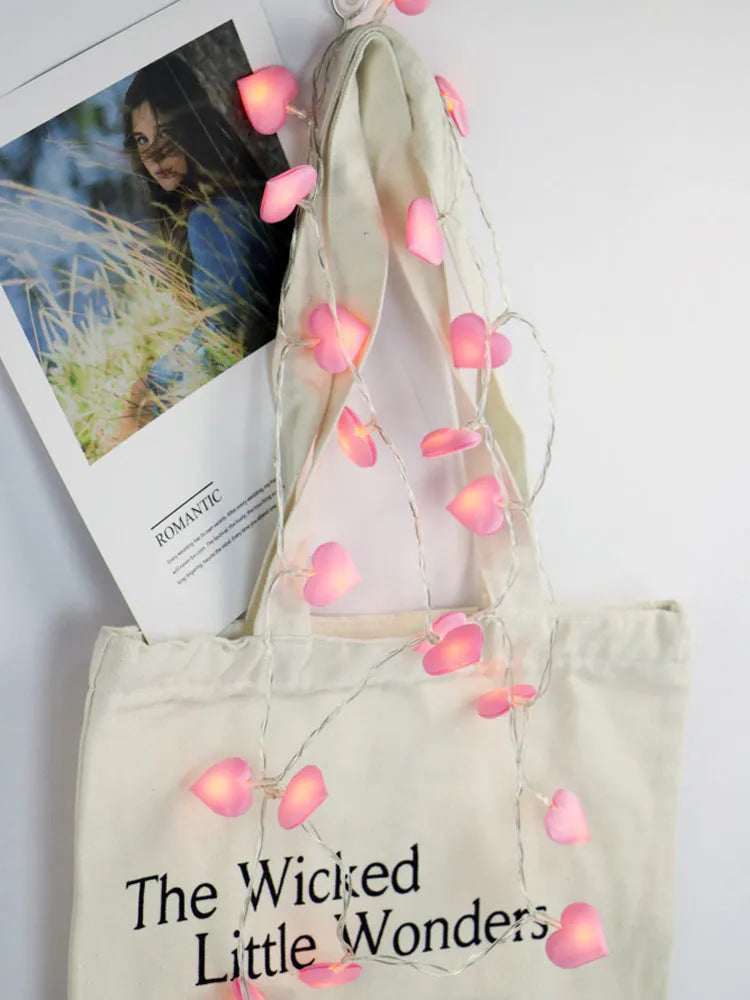 Pink battery-operated LED fairy string lights draped decoratively