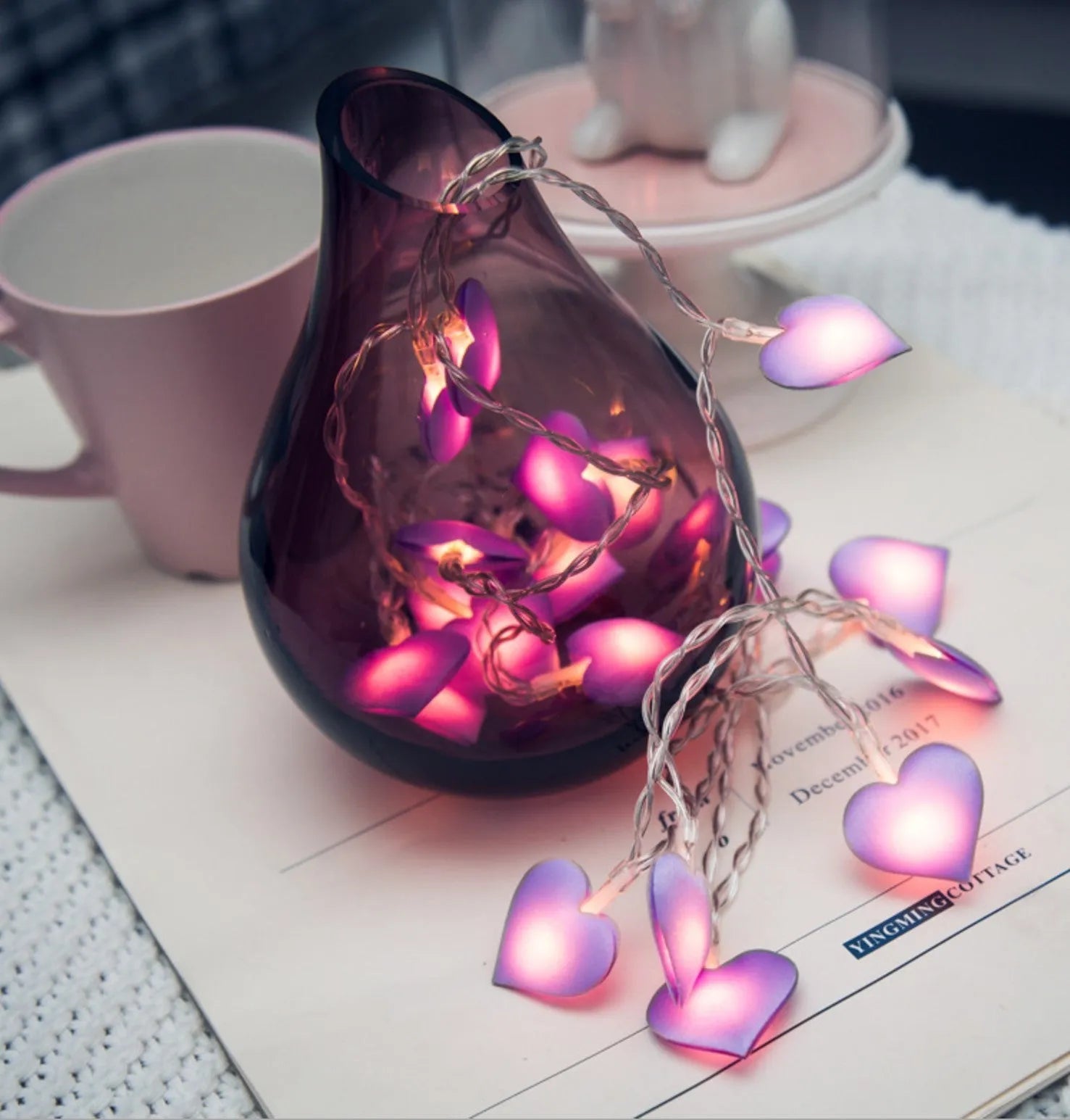 Pink battery-operated LED fairy string lights draped decoratively