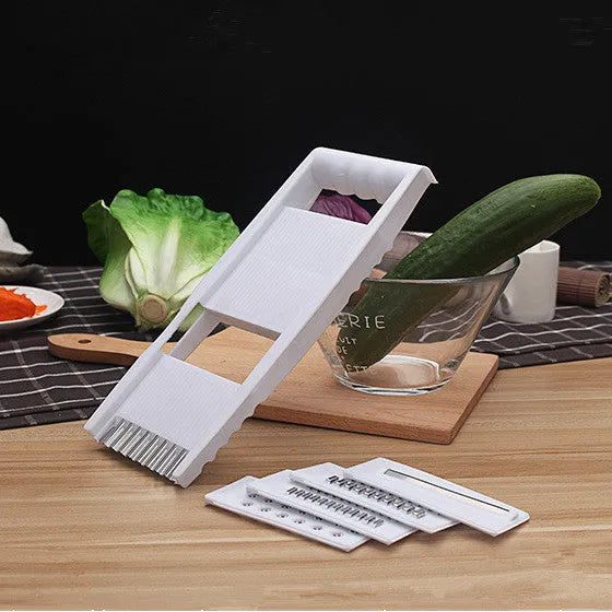 White home kitchen multifunctional grater with stainless steel blade and hand guard on white background