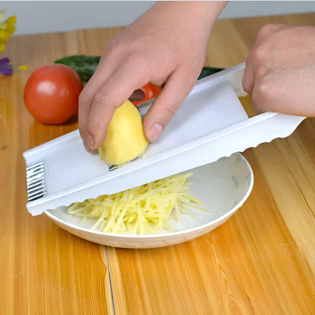 White home kitchen multifunctional grater with stainless steel blade and hand guard on white background