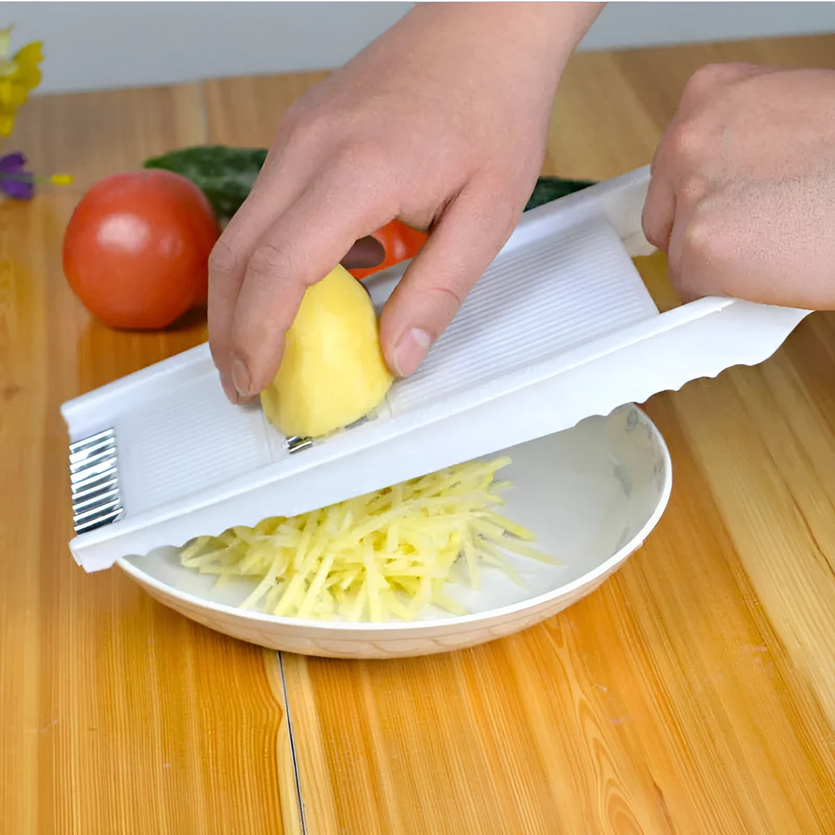 White home kitchen multifunctional grater with stainless steel blade and hand guard on white background