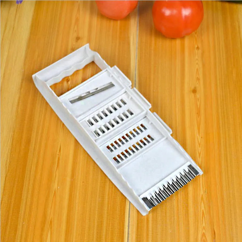 White home kitchen multifunctional grater with stainless steel blade and hand guard on white background