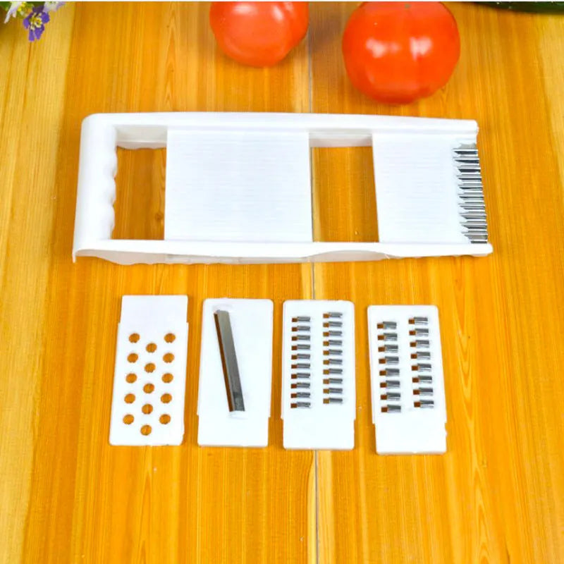 White home kitchen multifunctional grater with stainless steel blade and hand guard on white background