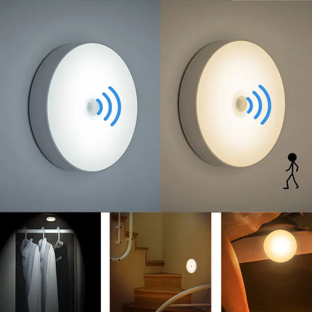 Small, round white LED night light with adhesive backing and a USB charging cable.