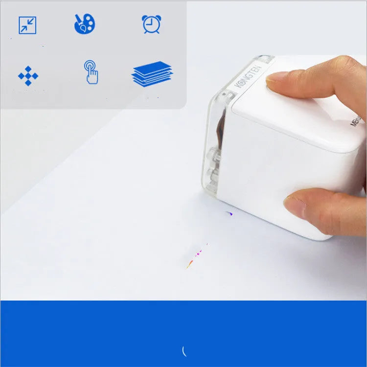 White Mbrush portable colour handheld inkjet printer on a surface with its compact dimensions 72x51x68mm visible