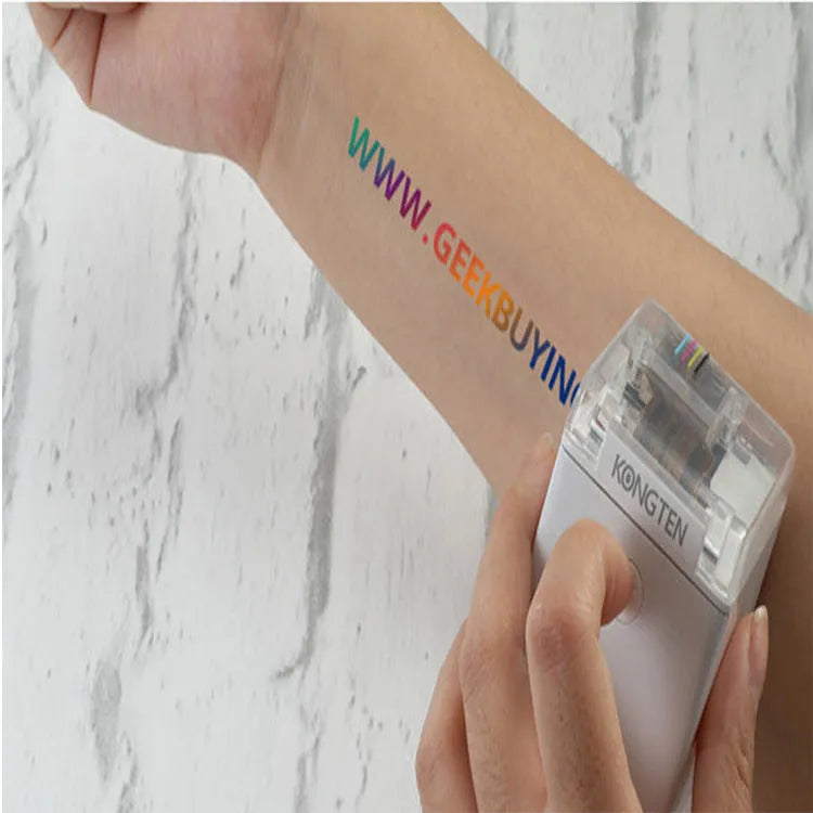 White Mbrush portable colour handheld inkjet printer on a surface with its compact dimensions 72x51x68mm visible