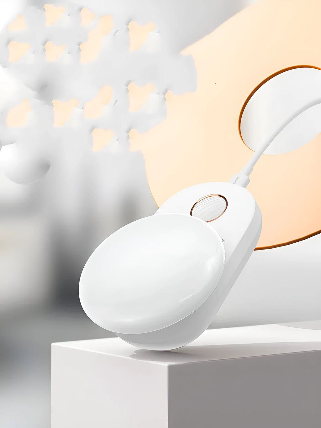 White Baseus Full Moon rechargeable LED sensor night light on a surface.