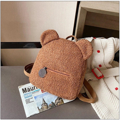 Cute, bear-shaped backpack made of soft, fleece material in various colors for casual travel and daily use