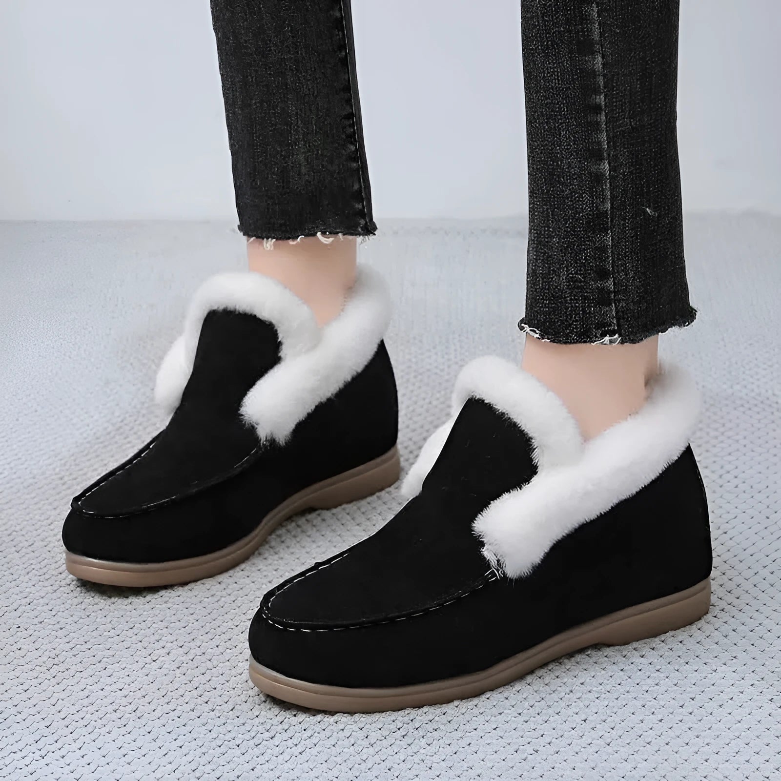 Women's round toe suede Martin boots in beige with rubber sole on a neutral background