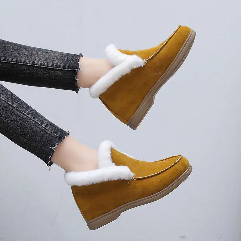 Women's round toe suede Martin boots in beige with rubber sole on a neutral background