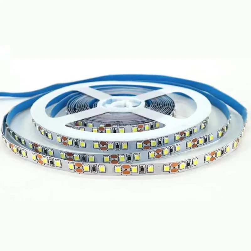 Close-up of a flexible LED strip light with closely spaced white SMD chips, showing its construction.