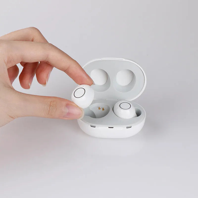 Yellow plastic hearing aid earpiece with ear tip, on-ear charging type, for sound amplification