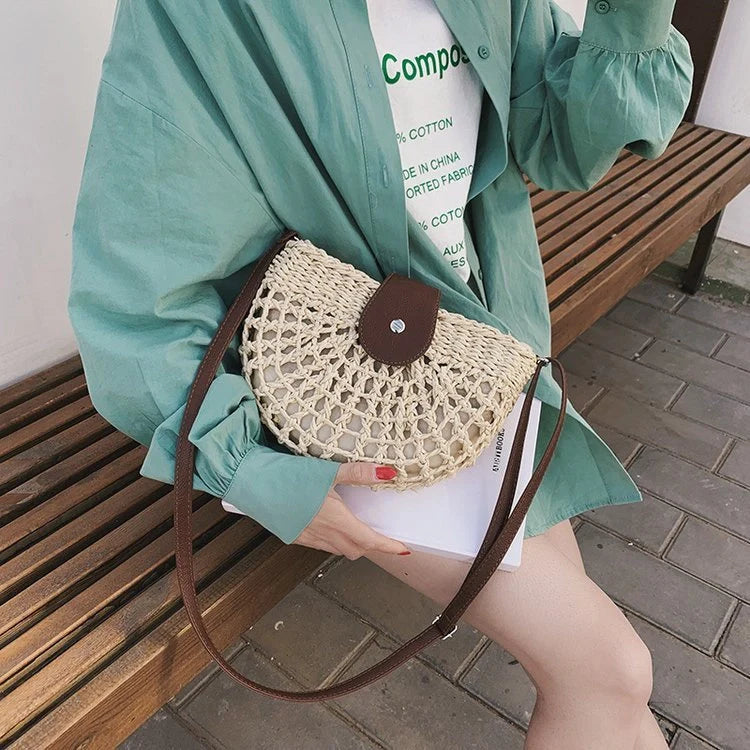 Trendy one-shoulder saddle straw bag with unique weaving detail