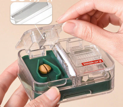 Portable mini medicine storage box with tablet cutter in red, green, blue, and white