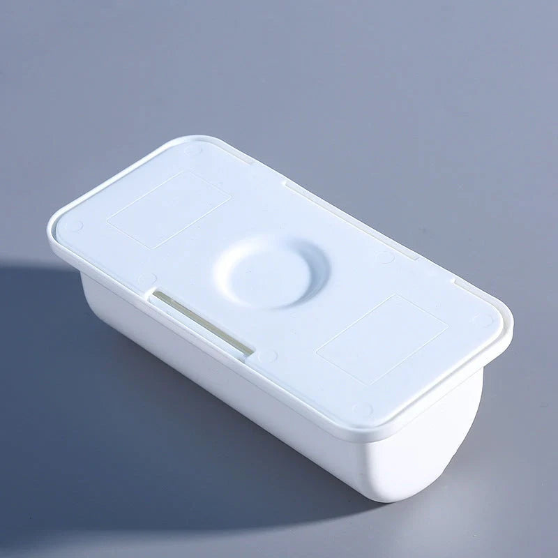 Wall-mounted plastic garbage bag holder in white, grey, and pink for kitchen organisation