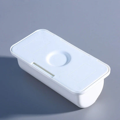 Wall-mounted plastic garbage bag holder in white, grey, and pink for kitchen organisation