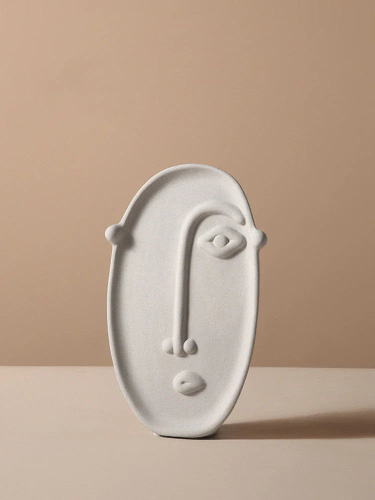 Stylish ceramic face vase with unique human-inspired designs, perfect for adding a touch of Kiwi charm to any living space