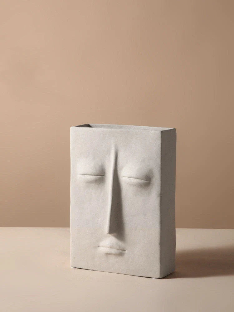 Stylish ceramic face vase with unique human-inspired designs, perfect for adding a touch of Kiwi charm to any living space