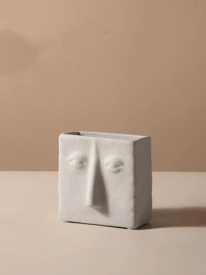 Stylish ceramic face vase with unique human-inspired designs, perfect for adding a touch of Kiwi charm to any living space