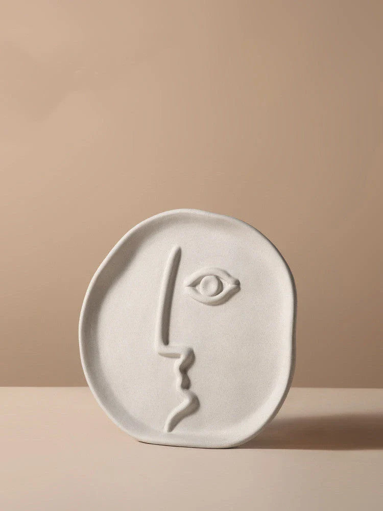 Stylish ceramic face vase with unique human-inspired designs, perfect for adding a touch of Kiwi charm to any living space