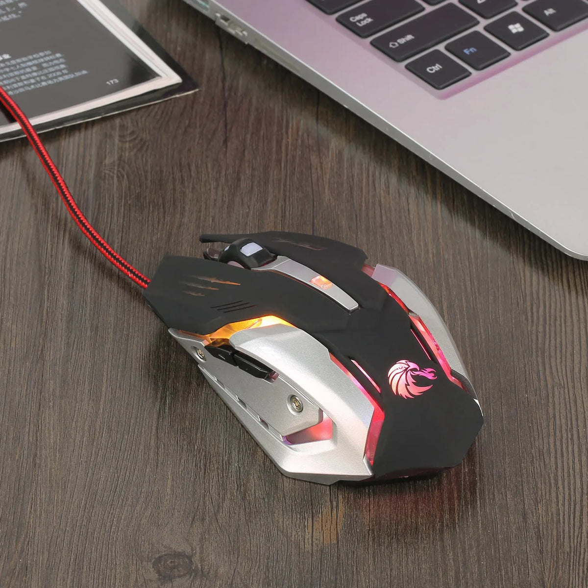 S100 wired gaming mouse in matte black with six buttons and scroll wheel on a white background