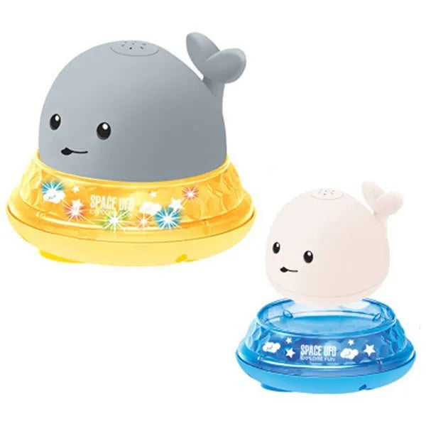Grey and white cartoon whale bath toy spraying water with LED lights glowing