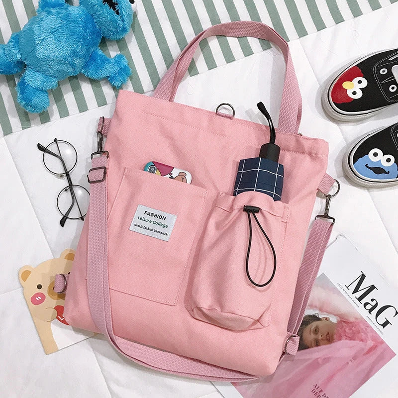 Harajuku-style canvas backpack with pockets, preppy design, and variety of color options for college students