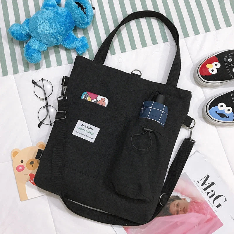 Harajuku-style canvas backpack with pockets, preppy design, and variety of color options for college students