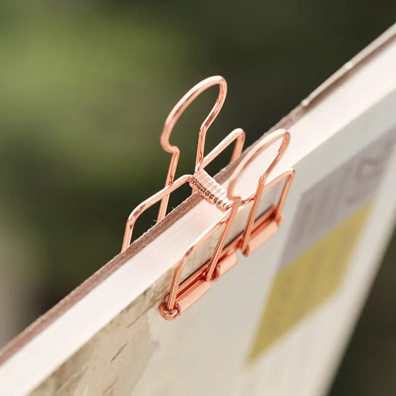 Rose gold metal binder set showing small and large sizes for ticket and test paper organisation