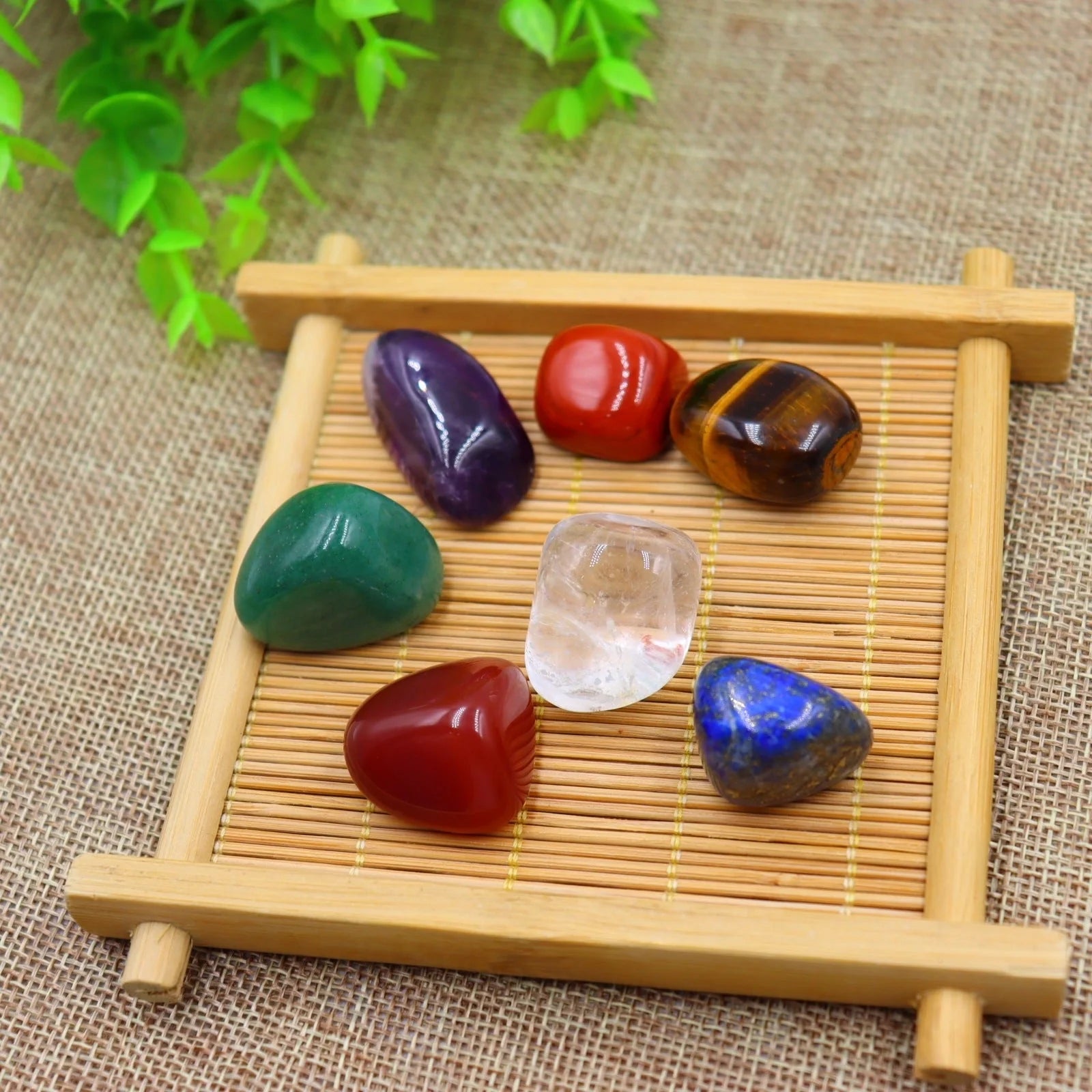 Seven Chakra Natural Stone Set with vibrant colors and black gift bag