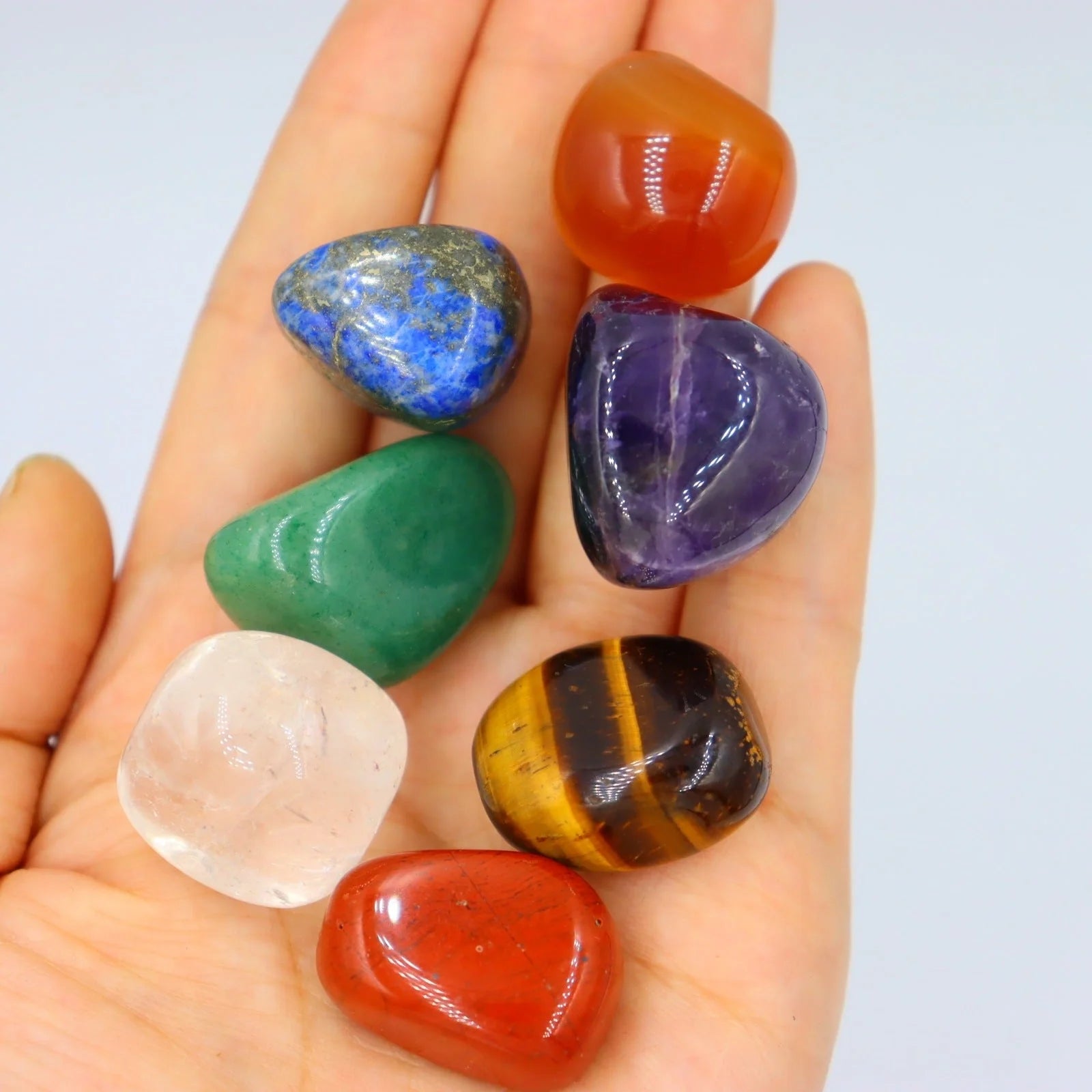 Seven Chakra Natural Stone Set with vibrant colors and black gift bag