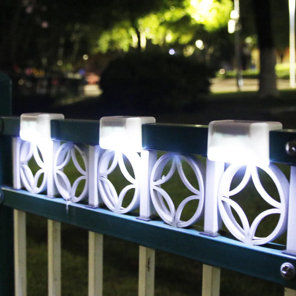 White shell solar-powered LED railing light with IP65 waterproof rating for outdoor steps.
