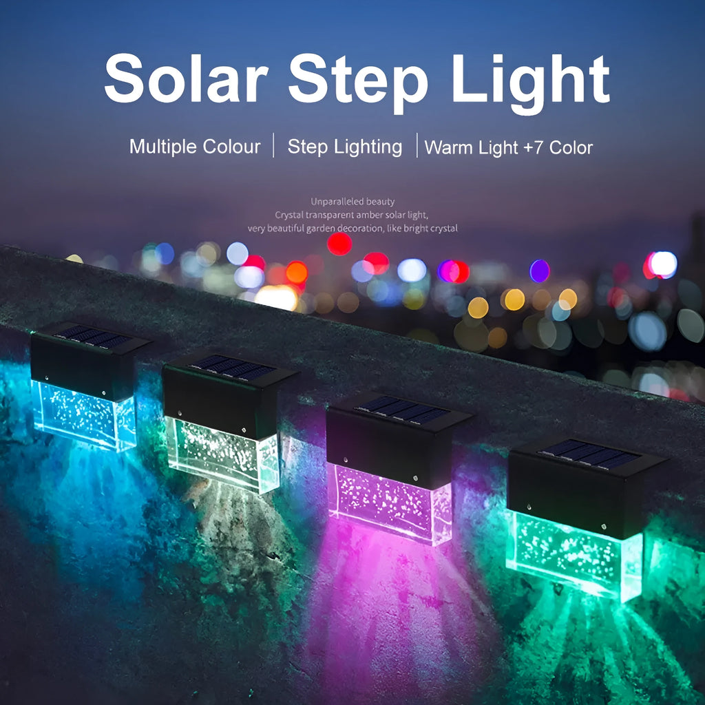 IP65 waterproof solar step light with crystal-like amber cover and RGB LED on a garden path