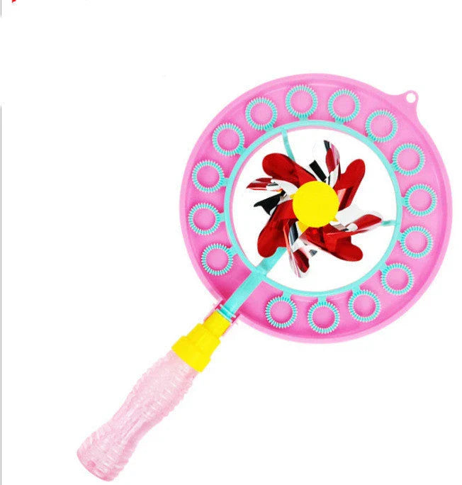 Kid playing with handheld windmill bubble blowing wand outdoors