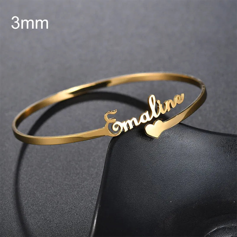 Custom name bracelet in stainless steel, silver finish, medium width, personalised engraving