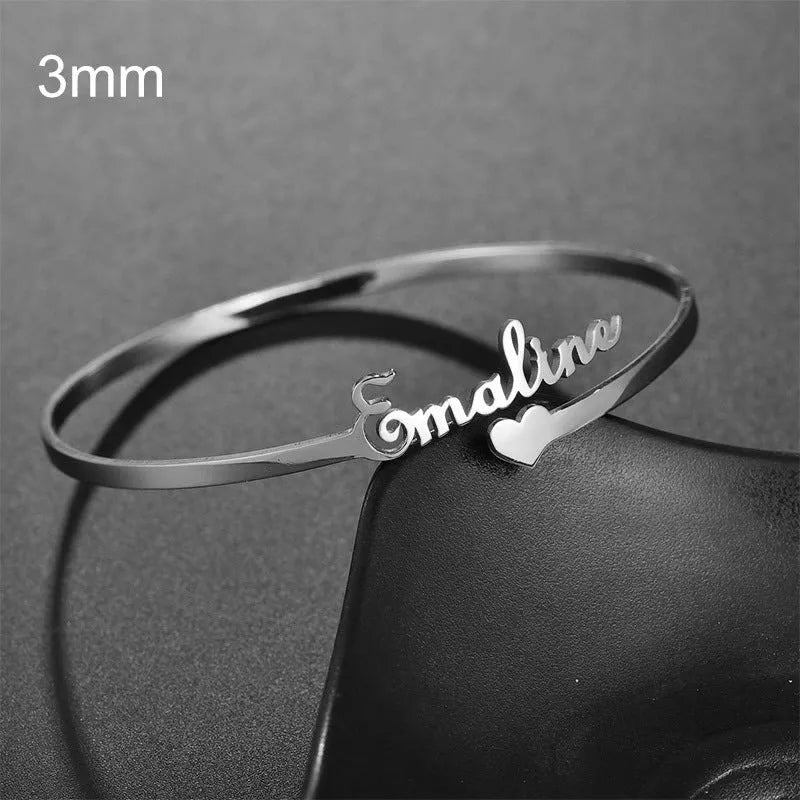 Custom name bracelet in stainless steel, silver finish, medium width, personalised engraving