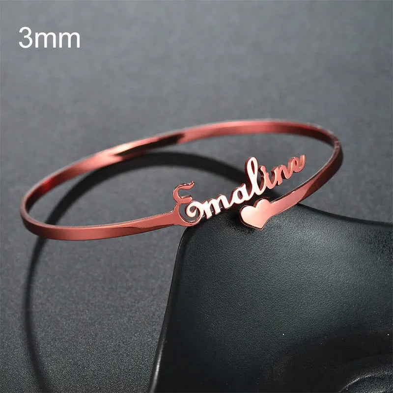 Custom name bracelet in stainless steel, silver finish, medium width, personalised engraving