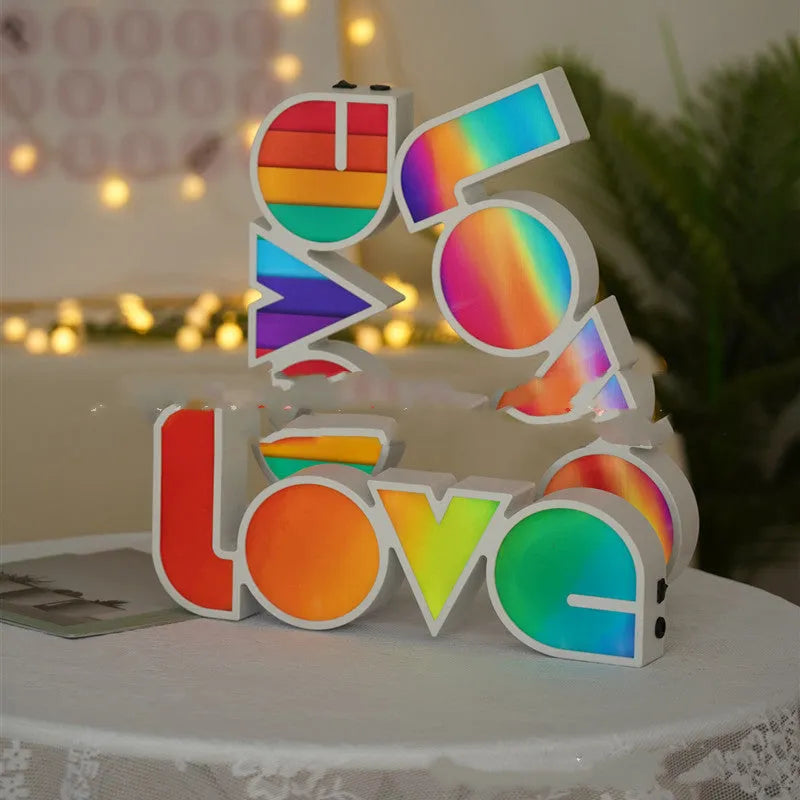 LOVE Colorful LED Letter Night Light with PVC shell showing purple illumination on a desk