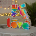 LOVE Colorful LED Letter Night Light with PVC shell showing purple illumination on a desk