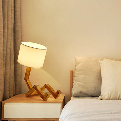 Robot shaped LED table lamp with flexible wooden base and linen shade